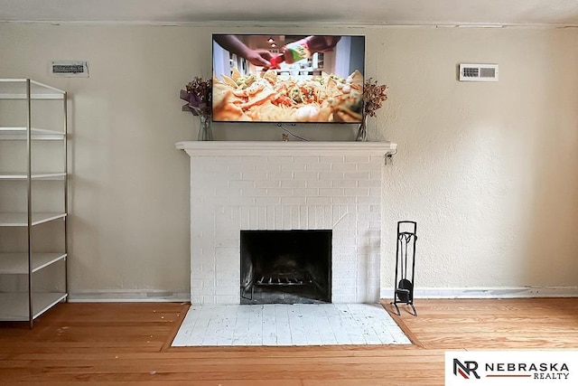 3340 N 48th Ave, Omaha, NE 68104 - detailed view of wood finished floors and a fireplace