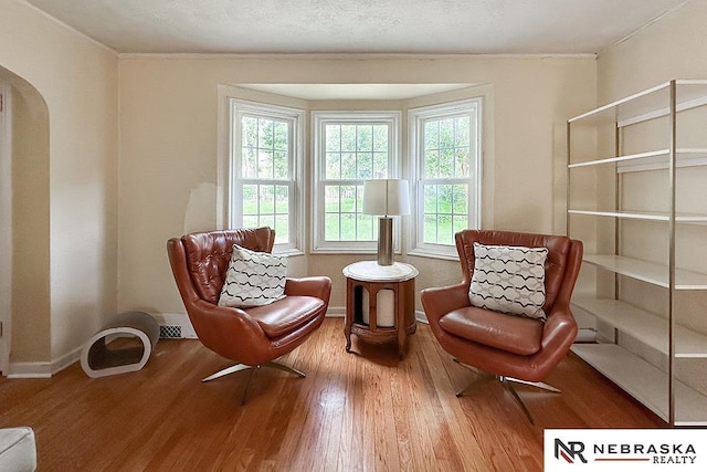 3340 N 48th Ave, Omaha, NE 68104 - sitting room featuring wood finished floors and arched walkways