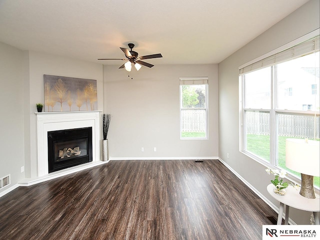 2906 Bar Harbor Dr, Bellevue, NE 68123 - unfurnished living room featuring wood finished floors, a ceiling fan, and a glass covered fireplace