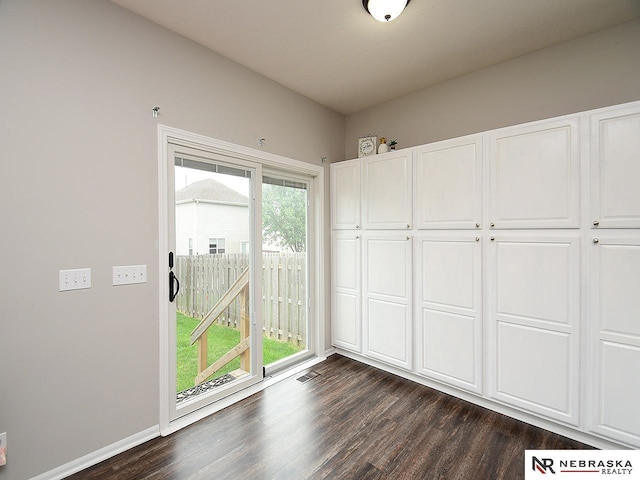 2906 Bar Harbor Dr, Bellevue, NE 68123 - unfurnished dining area with dark wood-style flooring