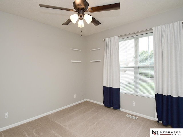 2906 Bar Harbor Dr, Bellevue, NE 68123 - spare room featuring ceiling fan and light colored carpet