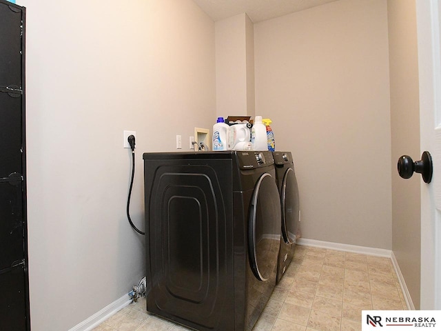 2906 Bar Harbor Dr, Bellevue, NE 68123 - laundry room with washing machine and dryer and baseboards
