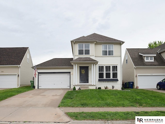 2906 Bar Harbor Dr, Bellevue, NE 68123 - traditional home featuring a front lawn, concrete driveway, and a garage