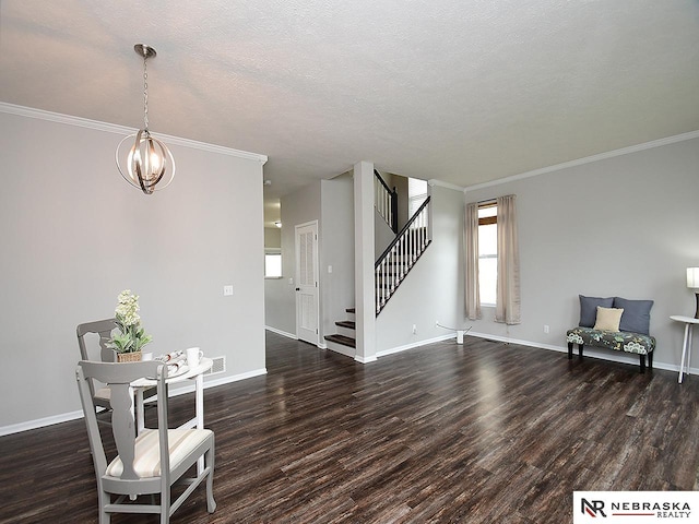 2906 Bar Harbor Dr, Bellevue, NE 68123 - dining area with wood finished floors, stairs, crown molding, a chandelier, and a textured ceiling