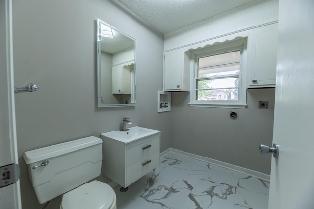 3701 Groves Rd, Bellevue, NE 68147 - half bathroom with vanity, marble finish flooring, and a textured ceiling