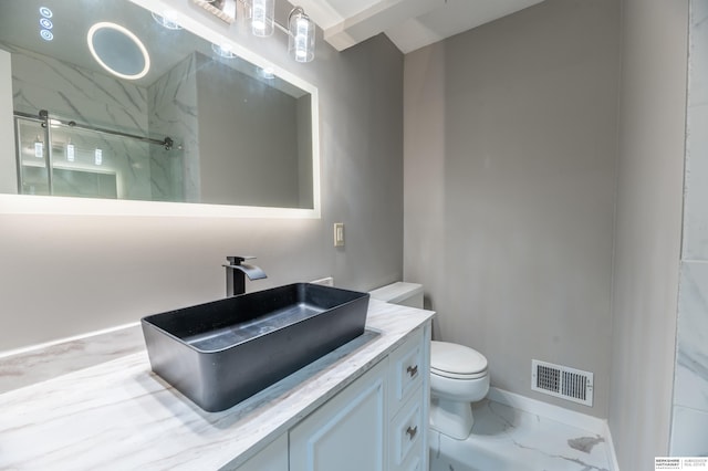 3701 Groves Rd, Bellevue, NE 68147 - bathroom featuring a marble finish shower, vanity, and marble look tile flooring