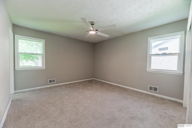 3701 Groves Rd, Bellevue, NE 68147 - carpeted spare room with ceiling fan and a textured ceiling