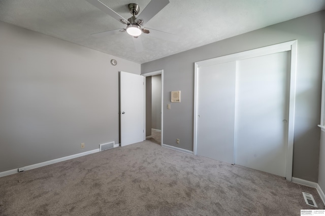 3701 Groves Rd, Bellevue, NE 68147 - unfurnished bedroom featuring carpet floors, a closet, and ceiling fan