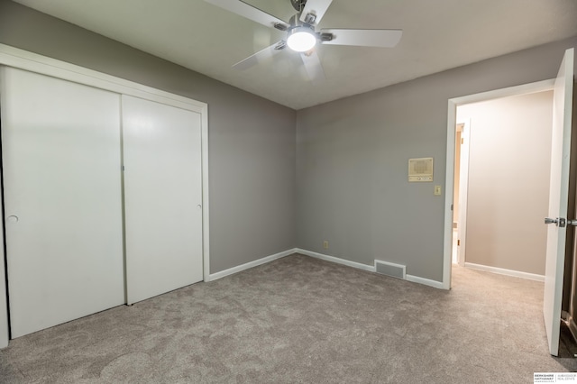 3701 Groves Rd, Bellevue, NE 68147 - unfurnished bedroom featuring carpet, a closet, and a ceiling fan