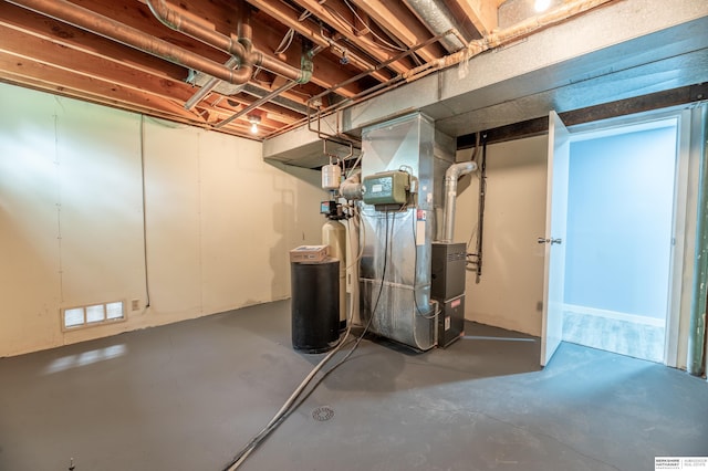 3701 Groves Rd, Bellevue, NE 68147 - unfinished below grade area featuring heating unit and a water softener system