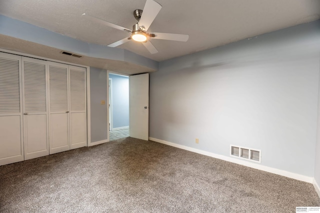 3701 Groves Rd, Bellevue, NE 68147 - unfurnished bedroom with carpet flooring, a closet, and a ceiling fan