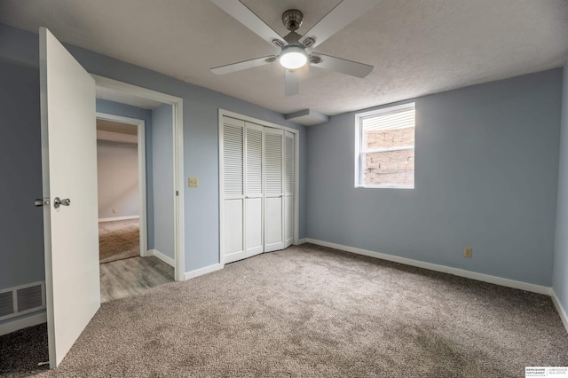 3701 Groves Rd, Bellevue, NE 68147 - unfurnished bedroom featuring carpet, a closet, and a ceiling fan