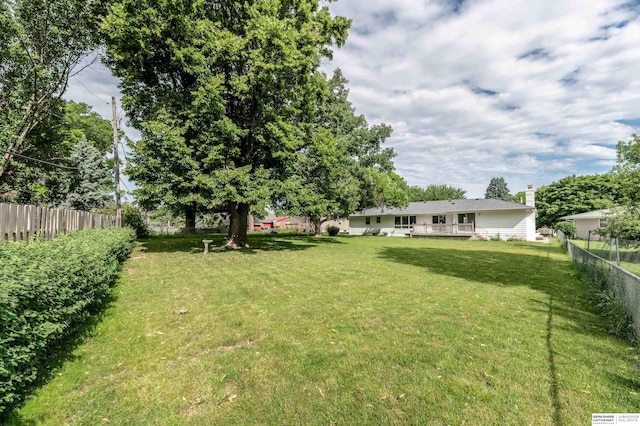 3701 Groves Rd, Bellevue, NE 68147 - fenced backyard with a wooden deck