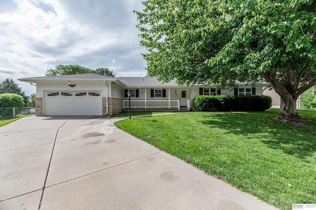 3701 Groves Rd, Bellevue, NE 68147 - ranch-style house with covered porch, driveway, an attached garage, and brick siding