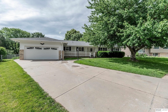 3701 Groves Rd, Bellevue, NE 68147 - view of front facade with driveway, a garage, and a porch
