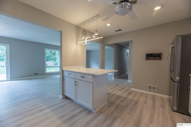 3701 Groves Rd, Bellevue, NE 68147 - kitchen featuring freestanding refrigerator, light wood-style flooring, healthy amount of natural light, a ceiling fan, and recessed lighting