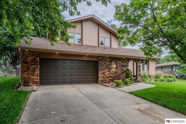12312 Decatur St, Omaha, NE 68154 - view of front facade with concrete driveway and brick siding