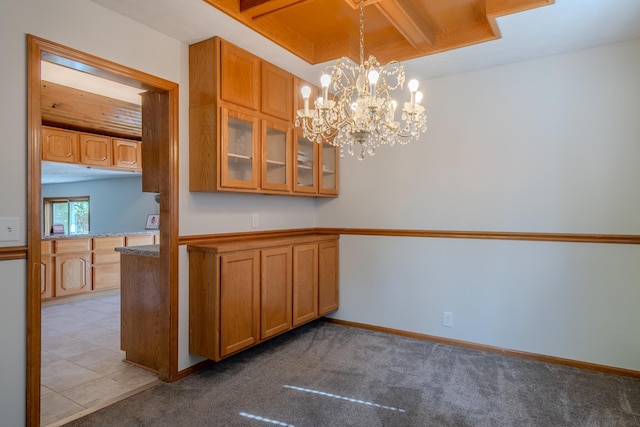12312 Decatur St, Omaha, NE 68154 - kitchen featuring brown cabinets, glass insert cabinets, a chandelier, carpet floors, and decorative light fixtures