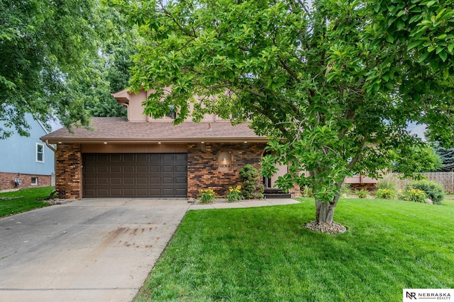 12312 Decatur St, Omaha, NE 68154 - obstructed view of property with concrete driveway, brick siding, and a garage