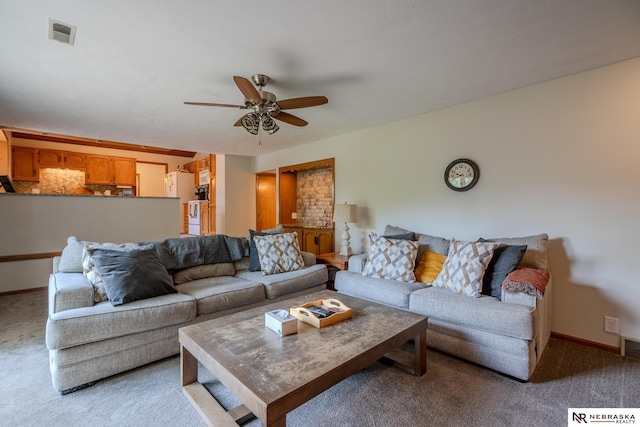 12312 Decatur St, Omaha, NE 68154 - carpeted living room with a ceiling fan and baseboards