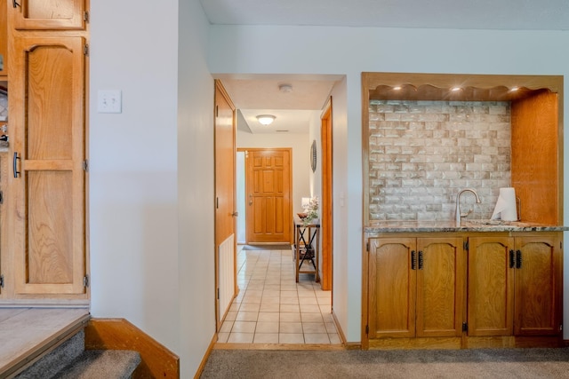 12312 Decatur St, Omaha, NE 68154 - hall featuring light tile patterned floors and light colored carpet