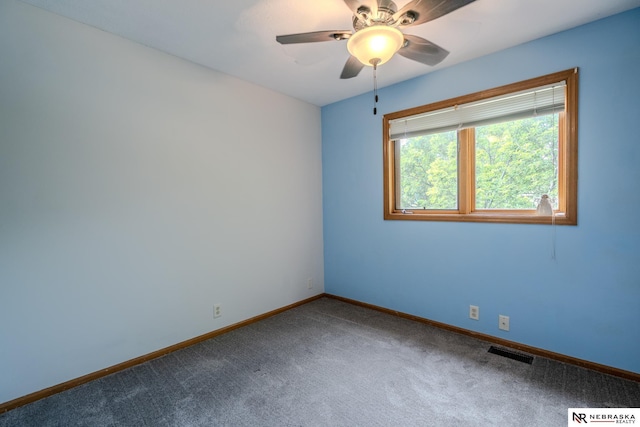 12312 Decatur St, Omaha, NE 68154 - unfurnished room featuring dark carpet and ceiling fan