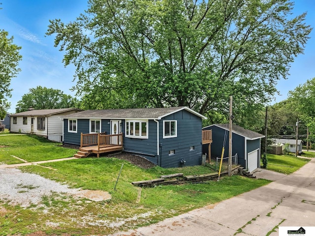 1107 N 6th St, Nebraska City, NE 68410 - ranch-style home with a deck, a detached garage, and a front yard