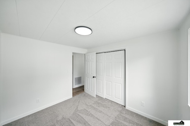 1107 N 6th St, Nebraska City, NE 68410 - unfurnished bedroom featuring carpet floors and a closet