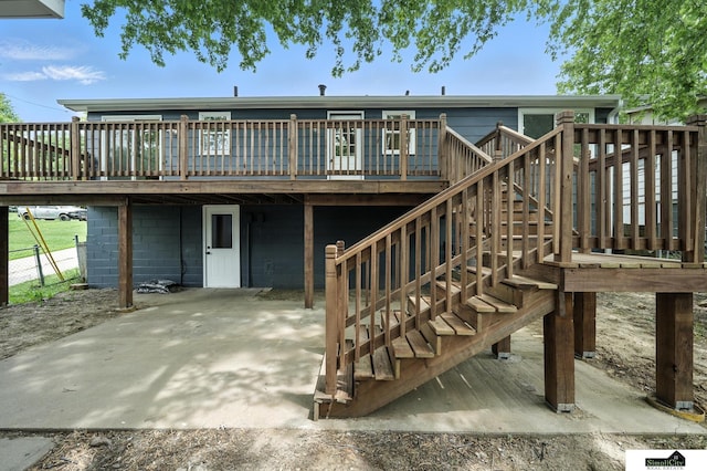 1107 N 6th St, Nebraska City, NE 68410 - rear view of property featuring a wooden deck, a patio area, and stairs