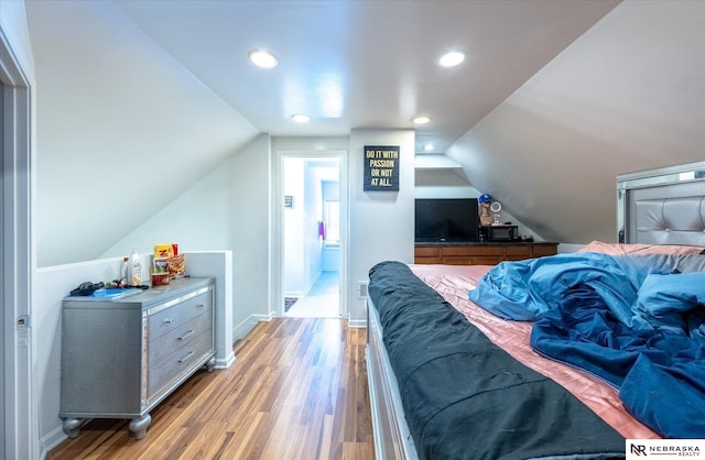 2567 Marcy St, Omaha, NE 68105 - bedroom featuring light wood-style flooring, vaulted ceiling, and recessed lighting