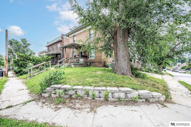 2567 Marcy St, Omaha, NE 68105 - exterior space featuring brick siding and a yard