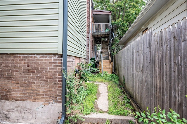 2567 Marcy St, Omaha, NE 68105 - view of side of property with a balcony and brick siding