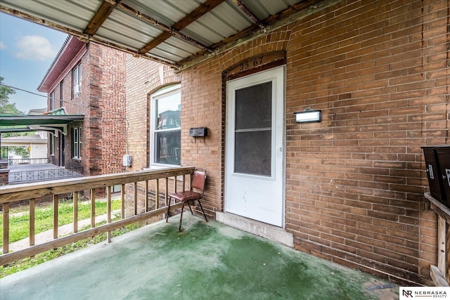 2567 Marcy St, Omaha, NE 68105 - doorway to property featuring brick siding