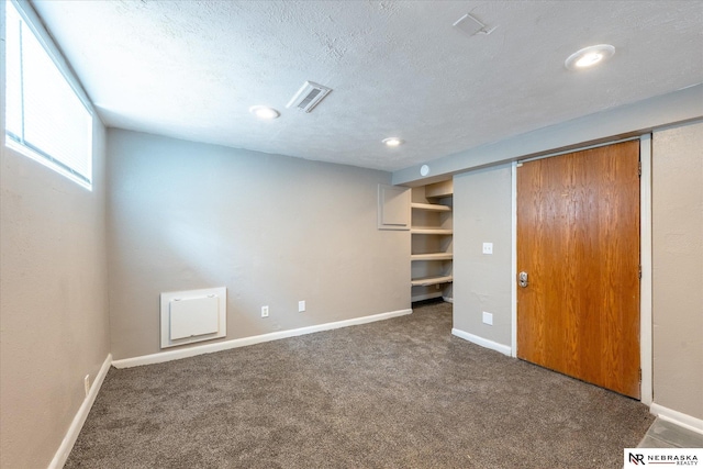 2567 Marcy St, Omaha, NE 68105 - unfurnished bedroom with carpet floors, a textured ceiling, recessed lighting, and a closet