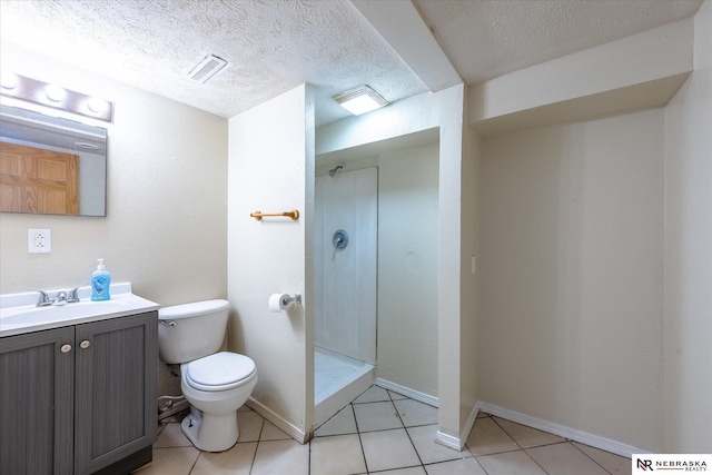 2567 Marcy St, Omaha, NE 68105 - full bath featuring vanity, walk in shower, tile patterned flooring, and a textured ceiling
