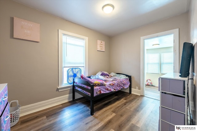 2567 Marcy St, Omaha, NE 68105 - bedroom featuring wood finished floors and baseboards