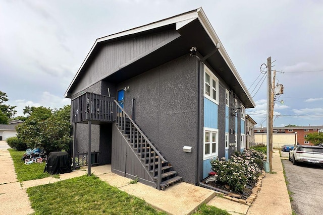 5125 Marshall Dr, Omaha, NE 68137 - view of home's exterior with stairs and a deck