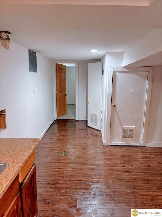 2715 S 15th St, Omaha, NE 68108 - unfurnished living room featuring wood finished floors and baseboards