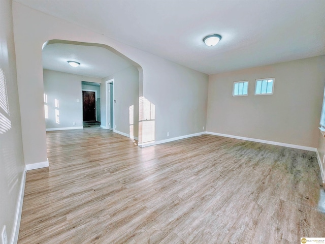 2715 S 15th St, Omaha, NE 68108 - unfurnished room with arched walkways and wood finished floors