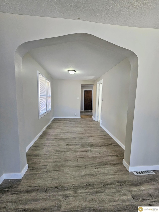 2715 S 15th St, Omaha, NE 68108 - unfurnished room with arched walkways and wood finished floors