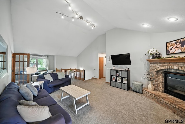 2303 N 150th Ave, Omaha, NE 68116 - living room with vaulted ceiling, carpet flooring, and a fireplace