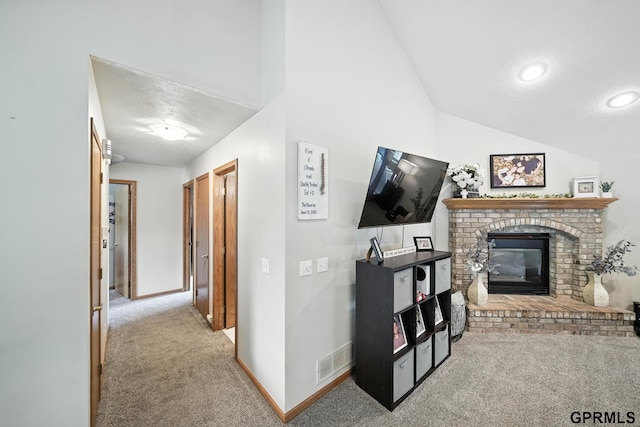 2303 N 150th Ave, Omaha, NE 68116 - living room with carpet, lofted ceiling, a fireplace, and recessed lighting