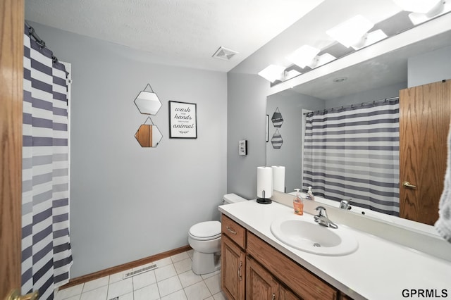 2303 N 150th Ave, Omaha, NE 68116 - full bath with vanity, tile patterned floors, and a textured ceiling