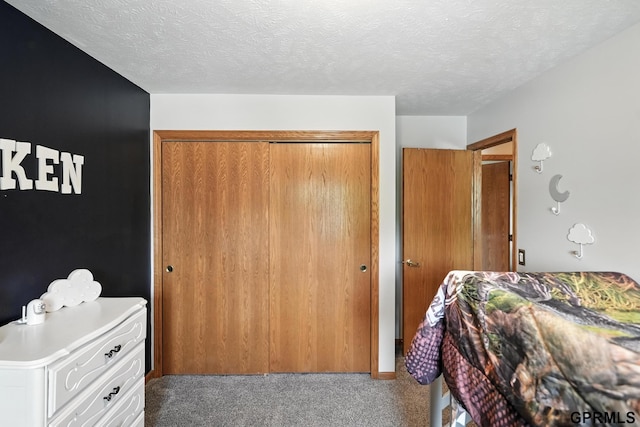 2303 N 150th Ave, Omaha, NE 68116 - bedroom with carpet flooring, a closet, and a textured ceiling