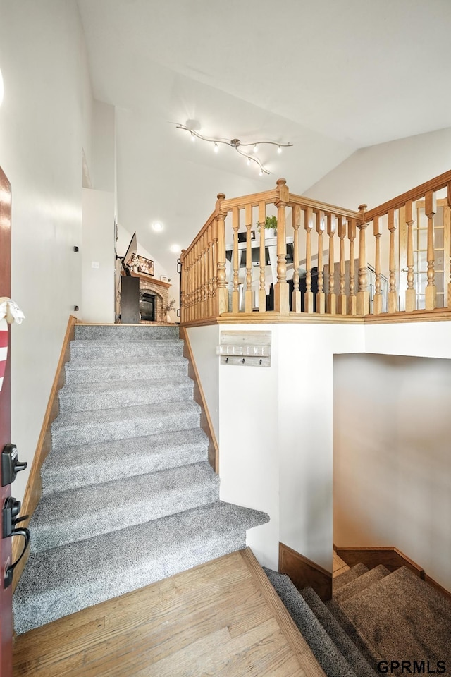 2303 N 150th Ave, Omaha, NE 68116 - staircase featuring vaulted ceiling