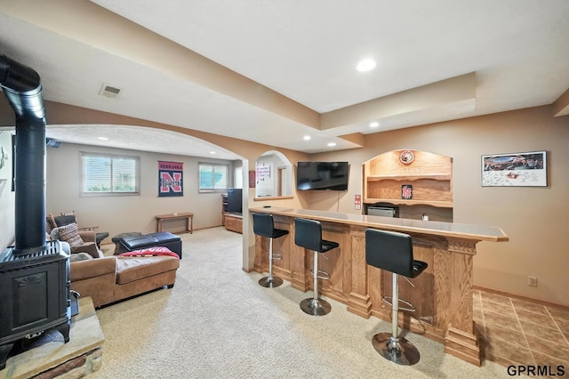 2303 N 150th Ave, Omaha, NE 68116 - indoor bar with a wood stove, recessed lighting, and light carpet