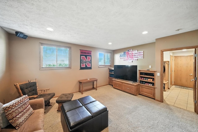 2303 N 150th Ave, Omaha, NE 68116 - living room featuring recessed lighting, light colored carpet, a textured ceiling, and light tile patterned floors