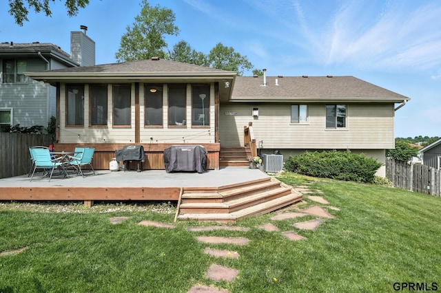 2303 N 150th Ave, Omaha, NE 68116 - rear view of house featuring a deck, a chimney, a shingled roof, and a sunroom