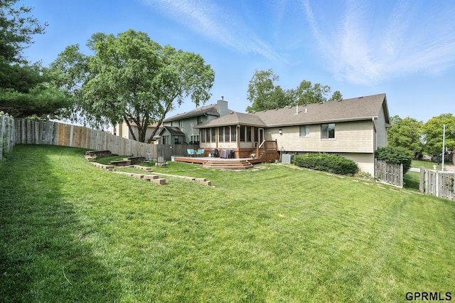 2303 N 150th Ave, Omaha, NE 68116 - rear view of property with a deck, a fenced backyard, and a sunroom
