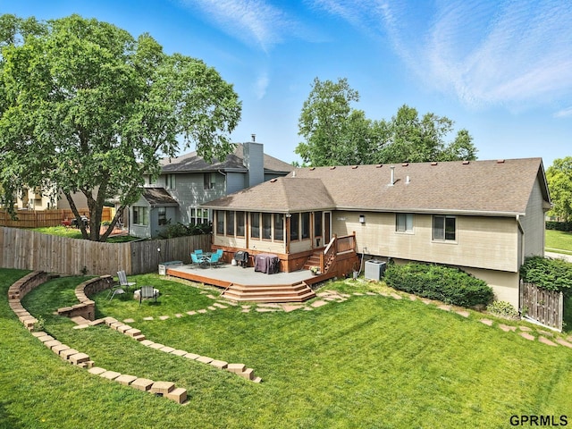 2303 N 150th Ave, Omaha, NE 68116 - back of house with a sunroom, a deck, roof with shingles, and a chimney